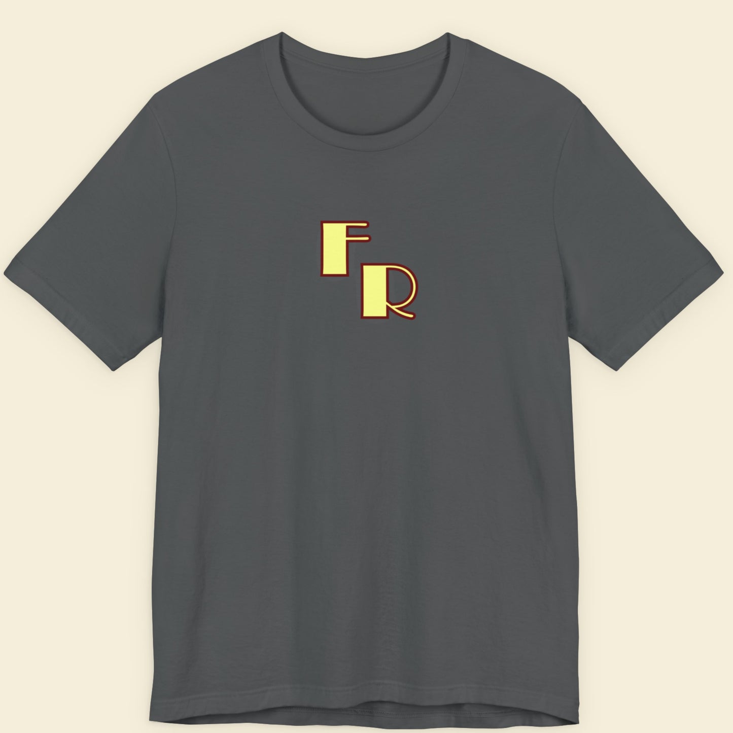 Gray t-shirt with gold 'FR' logo on a beige background