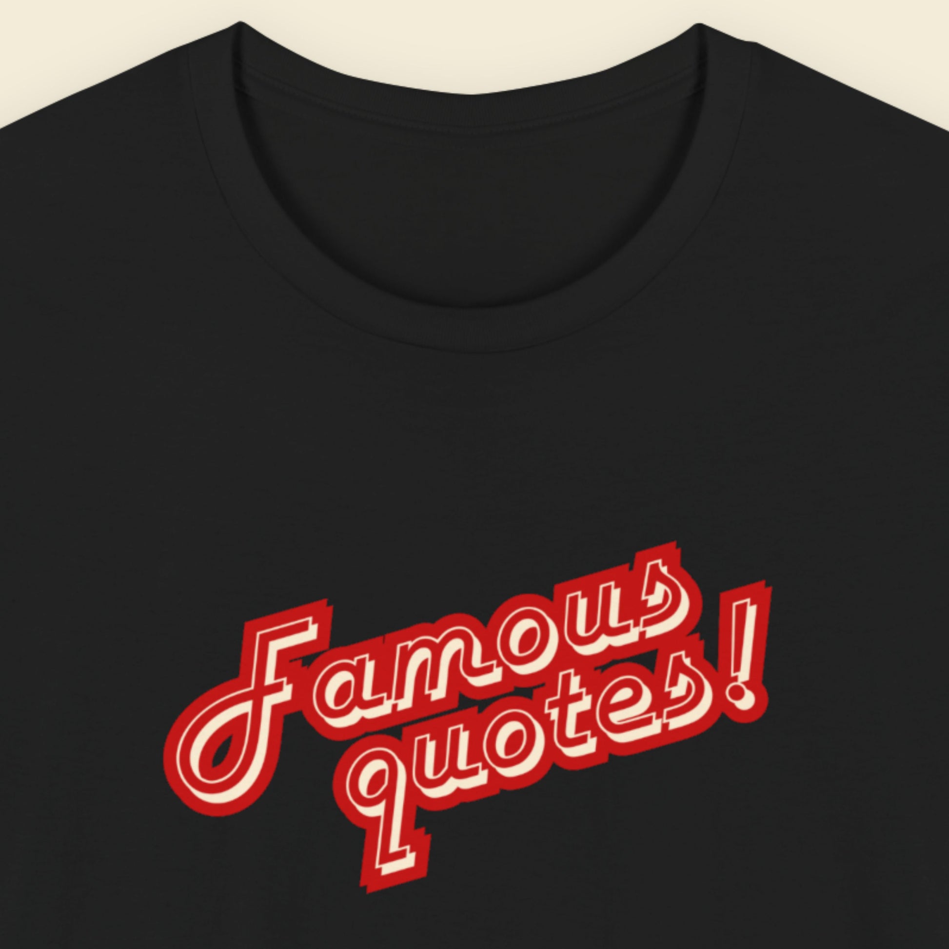 Black t-shirt with red and white text on a beige background.