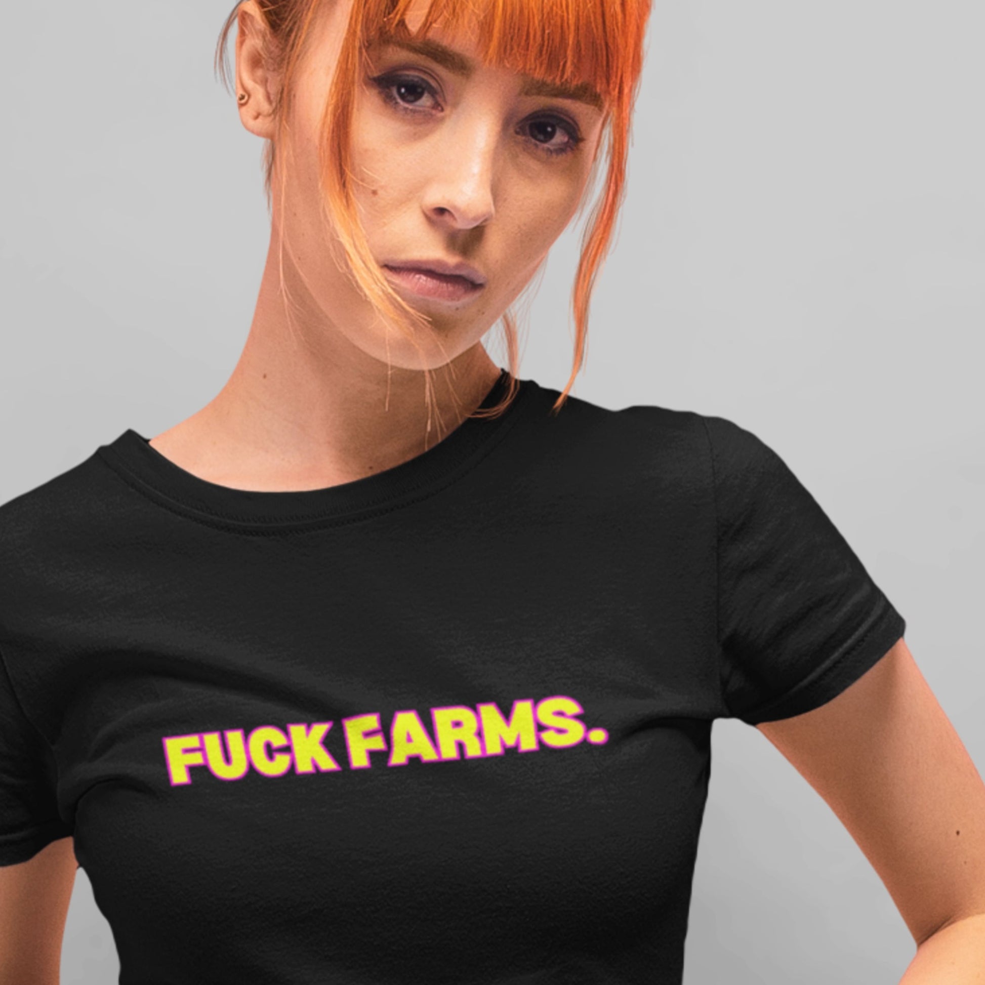 Person wearing a black t-shirt with 'FUCK FARMS.' in yellow text on a gray background