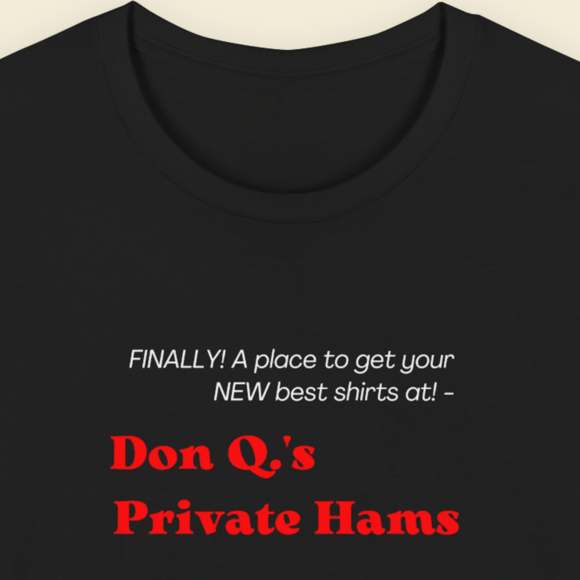 Black t-shirt with humorous colorful text on a beige background.