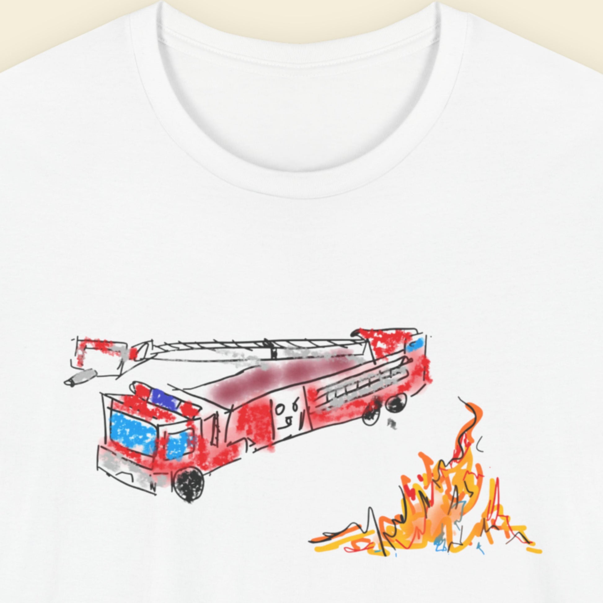 White shirt with a drawing of a fire truck and fire on a beige background.