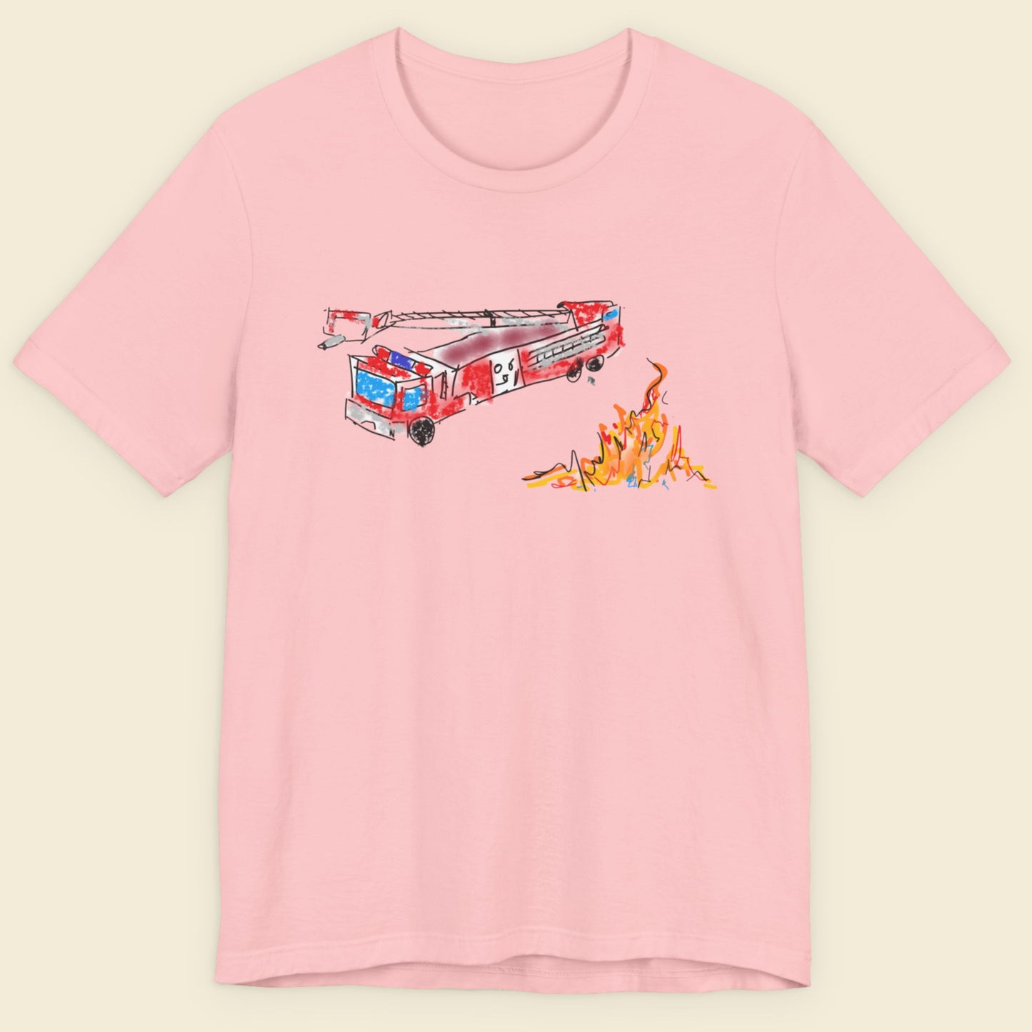 Pink t-shirt with a fire truck and flames graphic on a beige background.