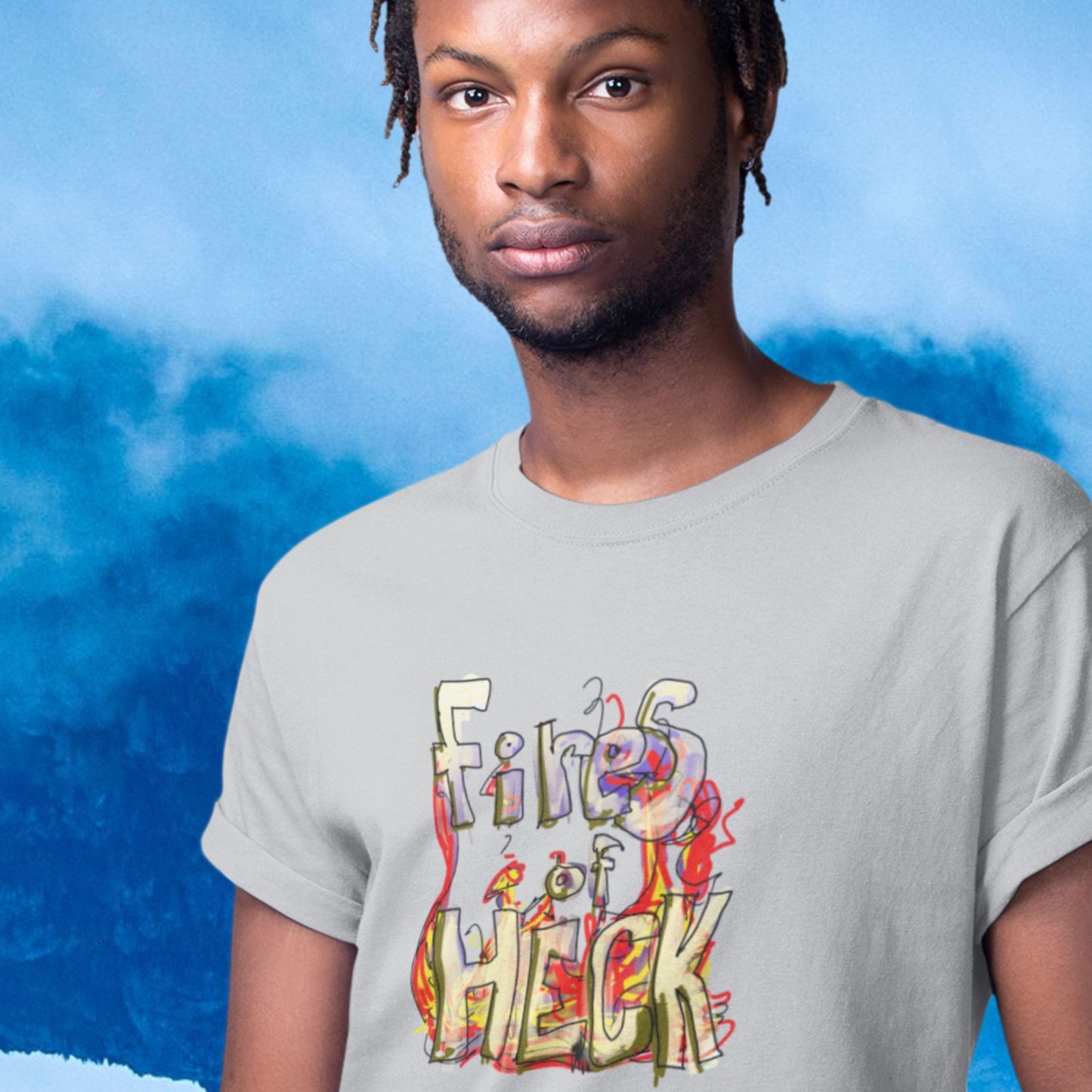 Man wearing a grey t-shirt with a colorful drawing on a sky background.