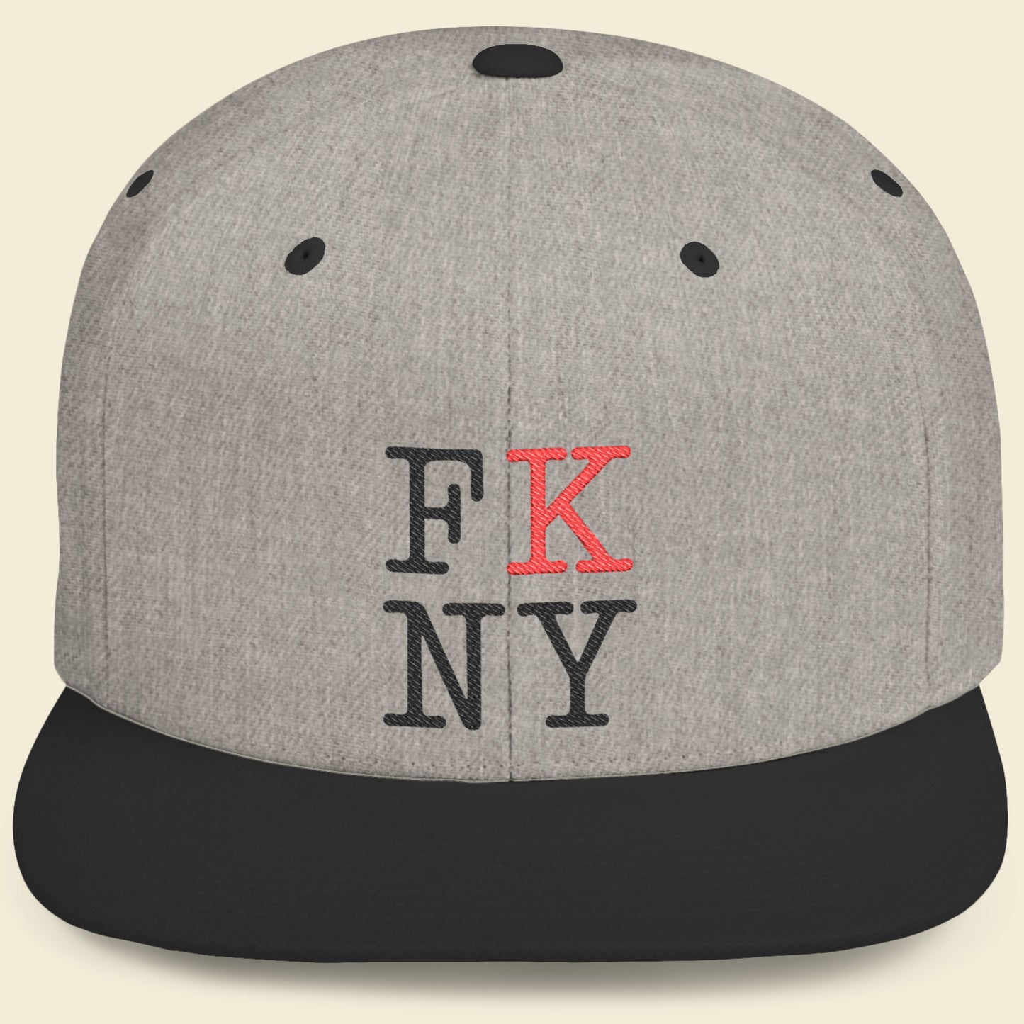Gray cap with black and red FK NY text on a beige background.