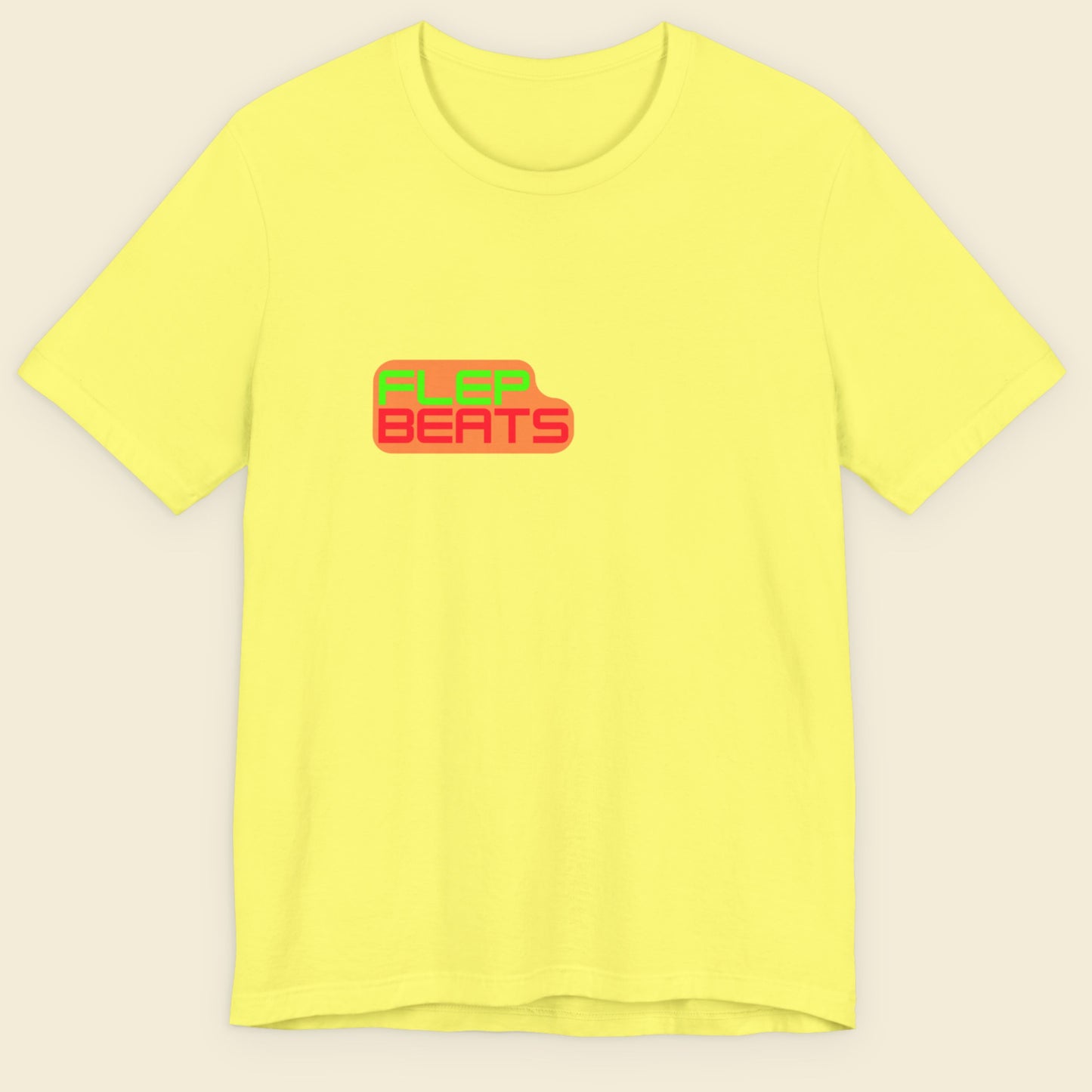 Yellow t-shirt with 'Flop Beats' text on a beige background.
