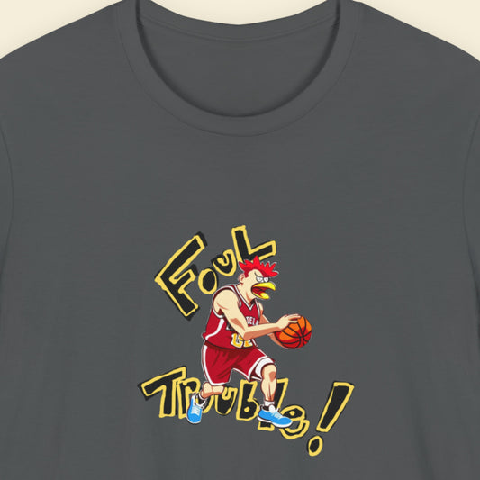 Grey t-shirt with a fun, colorful basketball cartoon illustration on a beige background.