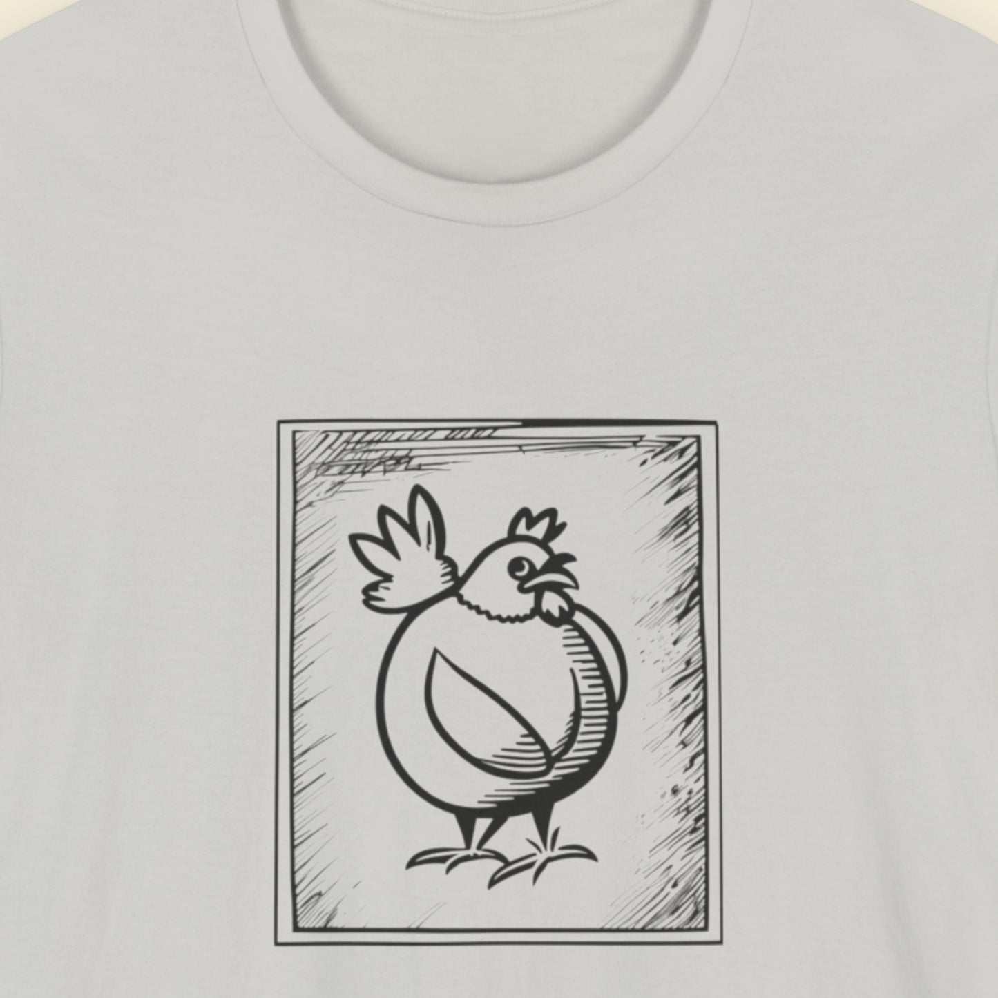 Light grey t-shirt with a framed drawing of a chicken.