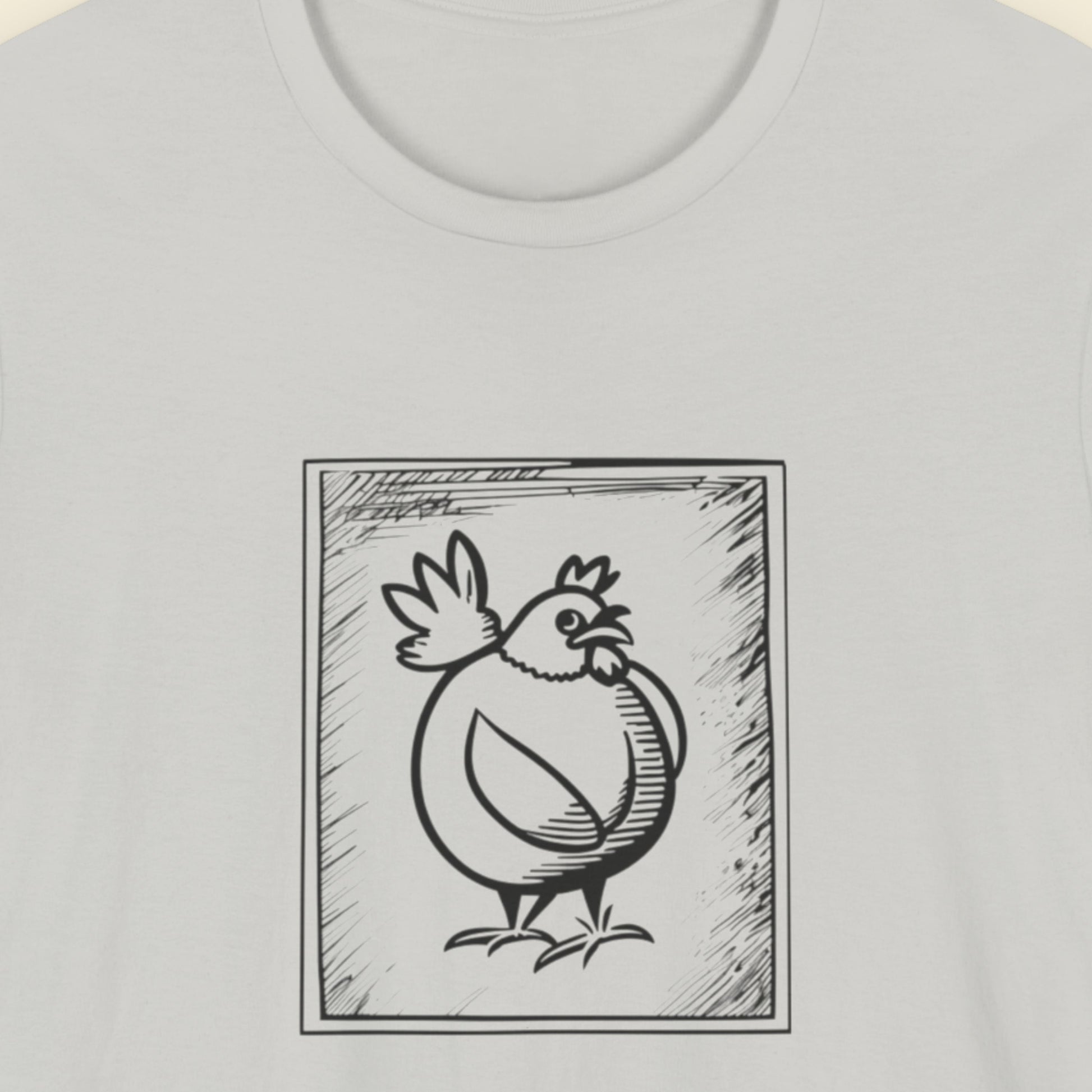 Light grey t-shirt with a framed drawing of a chicken.