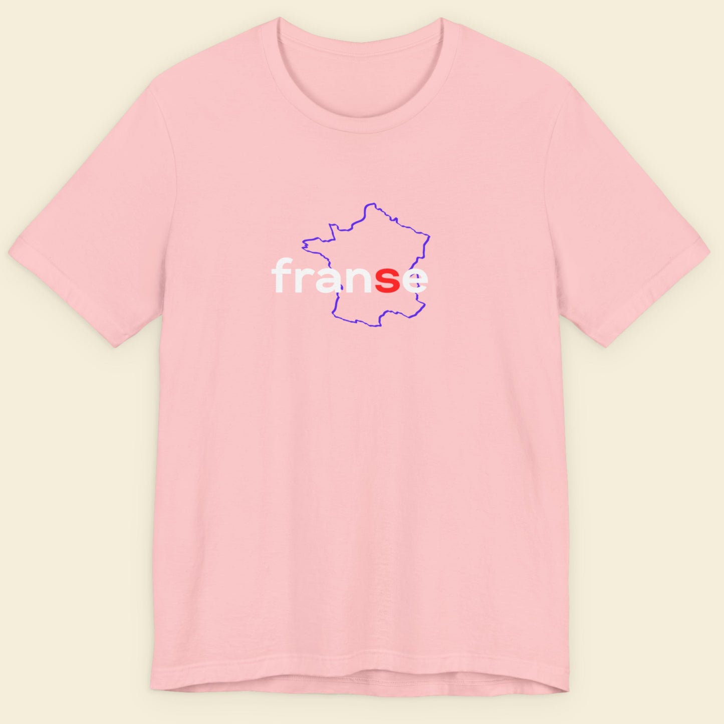Pink t-shirt with humorous colorful text on a beige background.