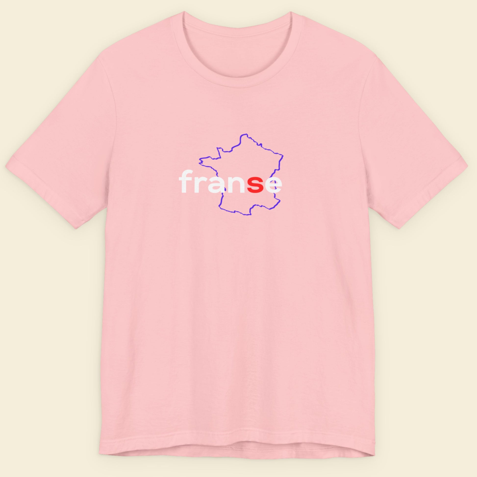 Pink t-shirt with humorous colorful text on a beige background.
