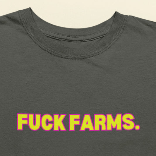 Dark gray t-shirt with bright yellow text 'FUCK FARMS.' on a beige background