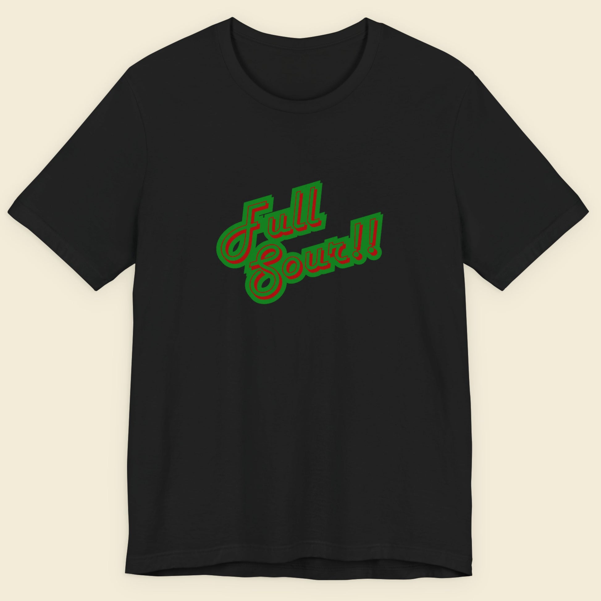 Black t-shirt with colorful humorous text on a beige background.
