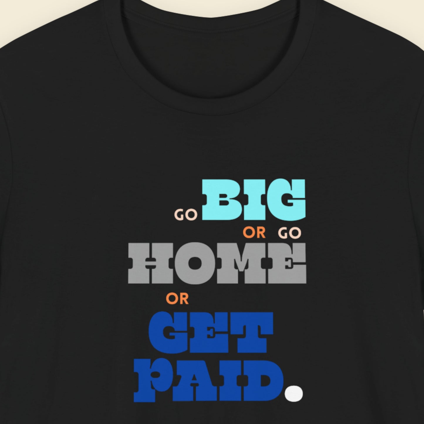 Black t-shirt with humorous colorful text on a beige background.