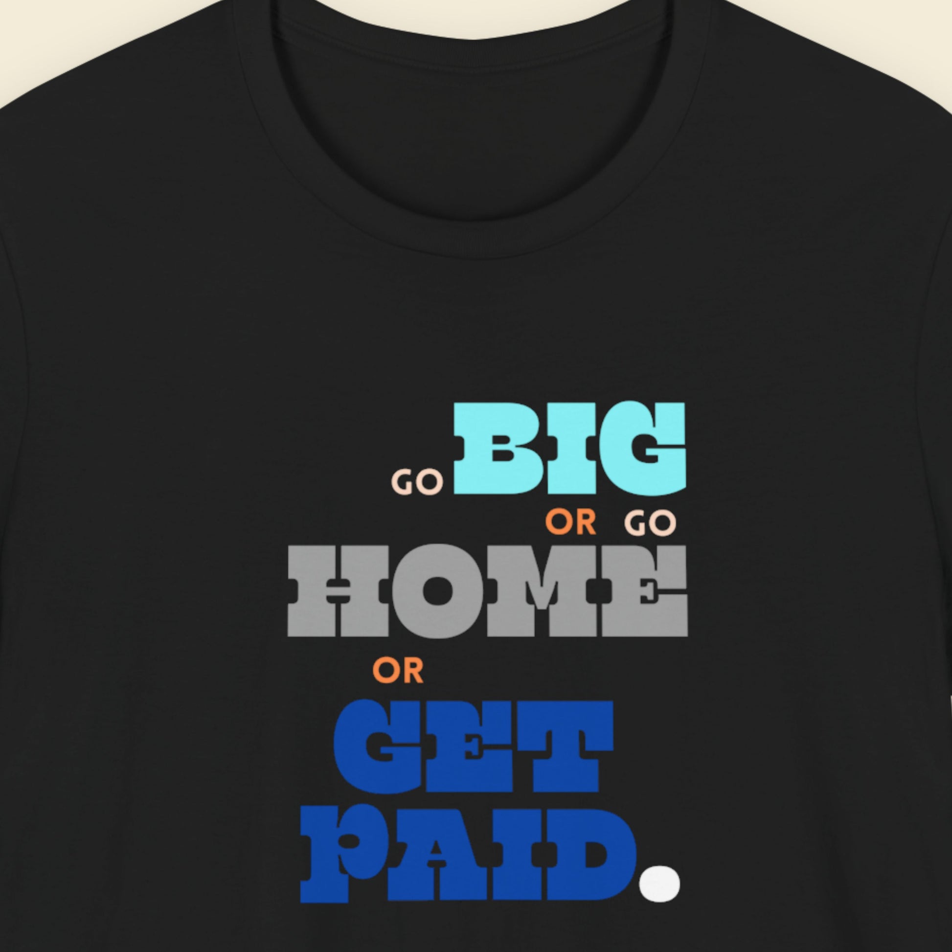 Black t-shirt with humorous colorful text on a beige background.