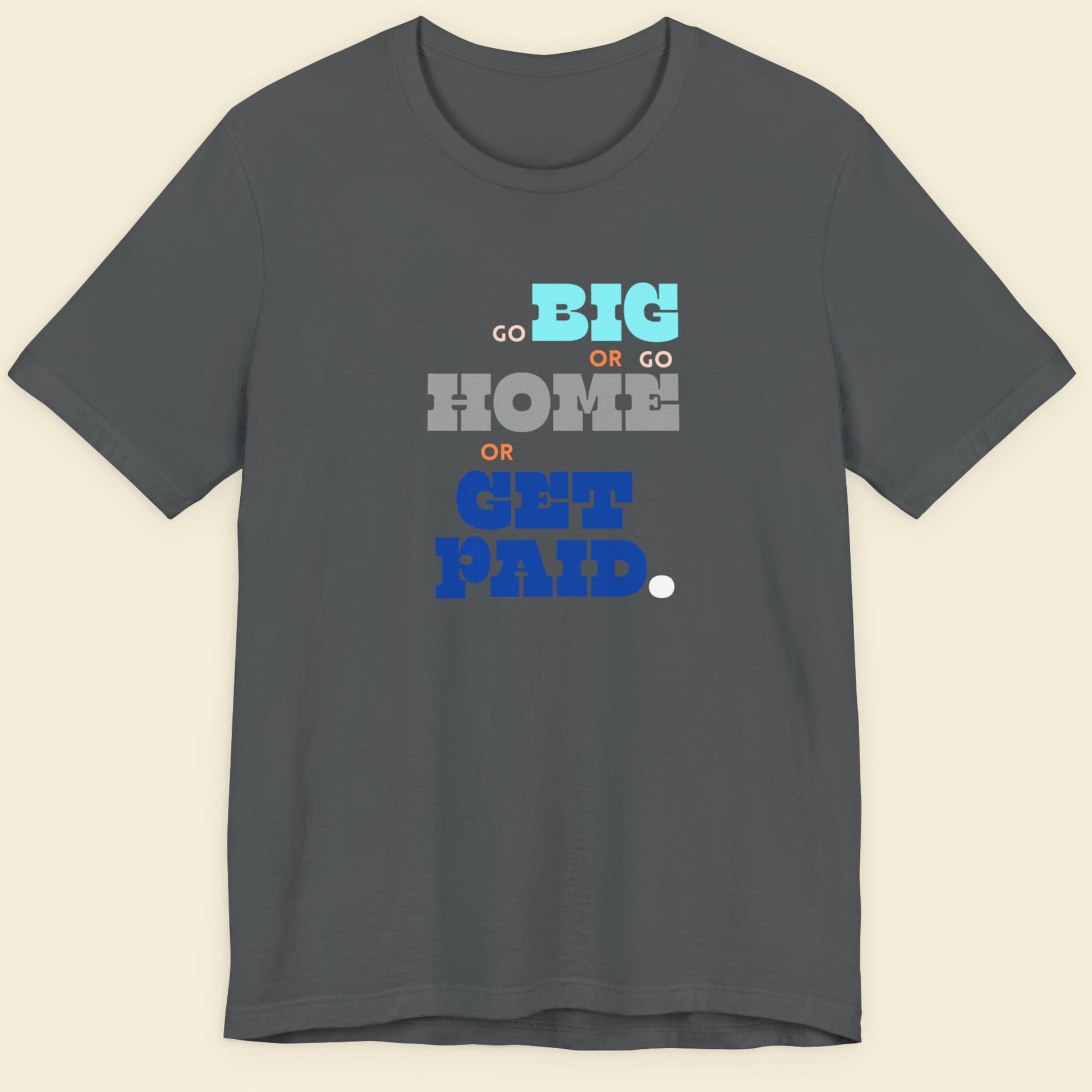 Grey t-shirt with humorous colorful text on a beige background.