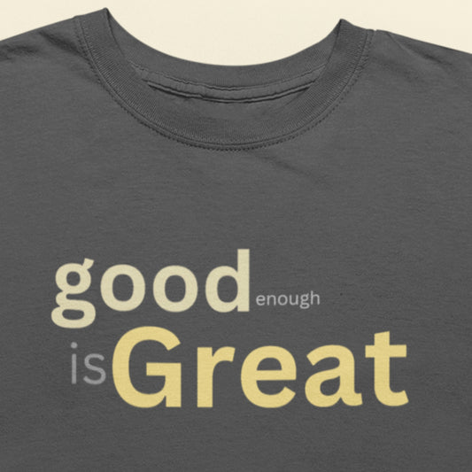 Gray t-shirt with 'good enough is Great' text in yellow on a beige background