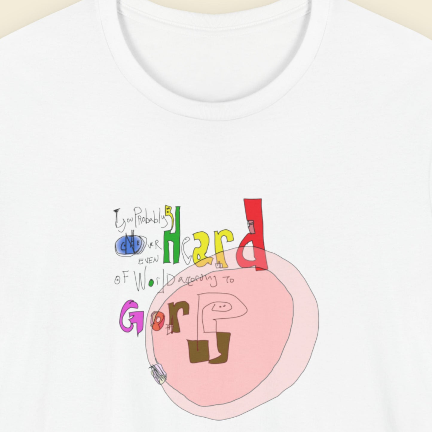 White t-shirt with a colorful abstract graffiti drawing on a beige background.