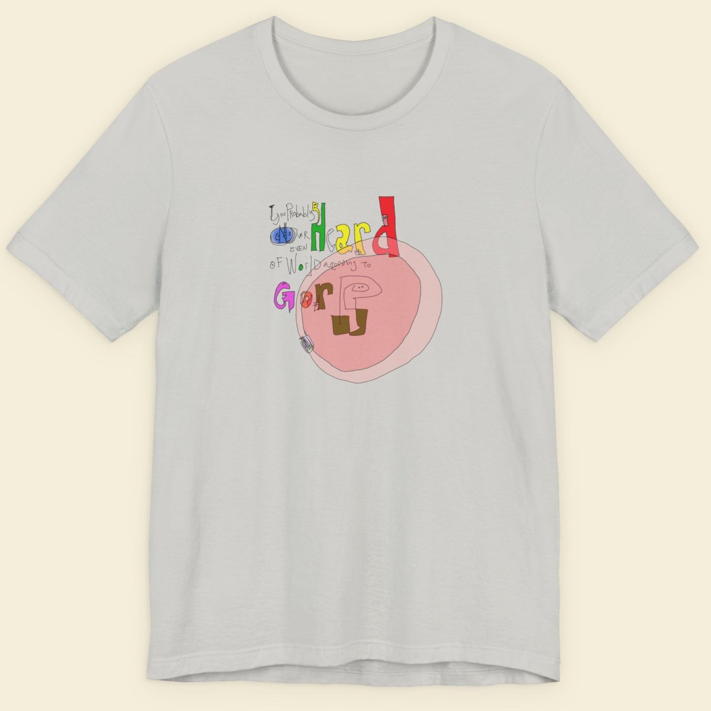 Grey t-shirt with a colorful abstract graffiti drawing on a beige background.