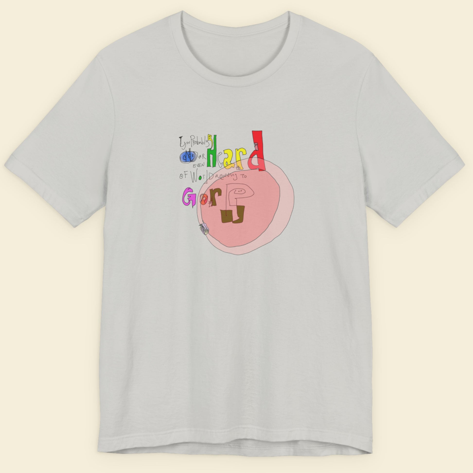 Grey t-shirt with a colorful abstract graffiti drawing on a beige background.
