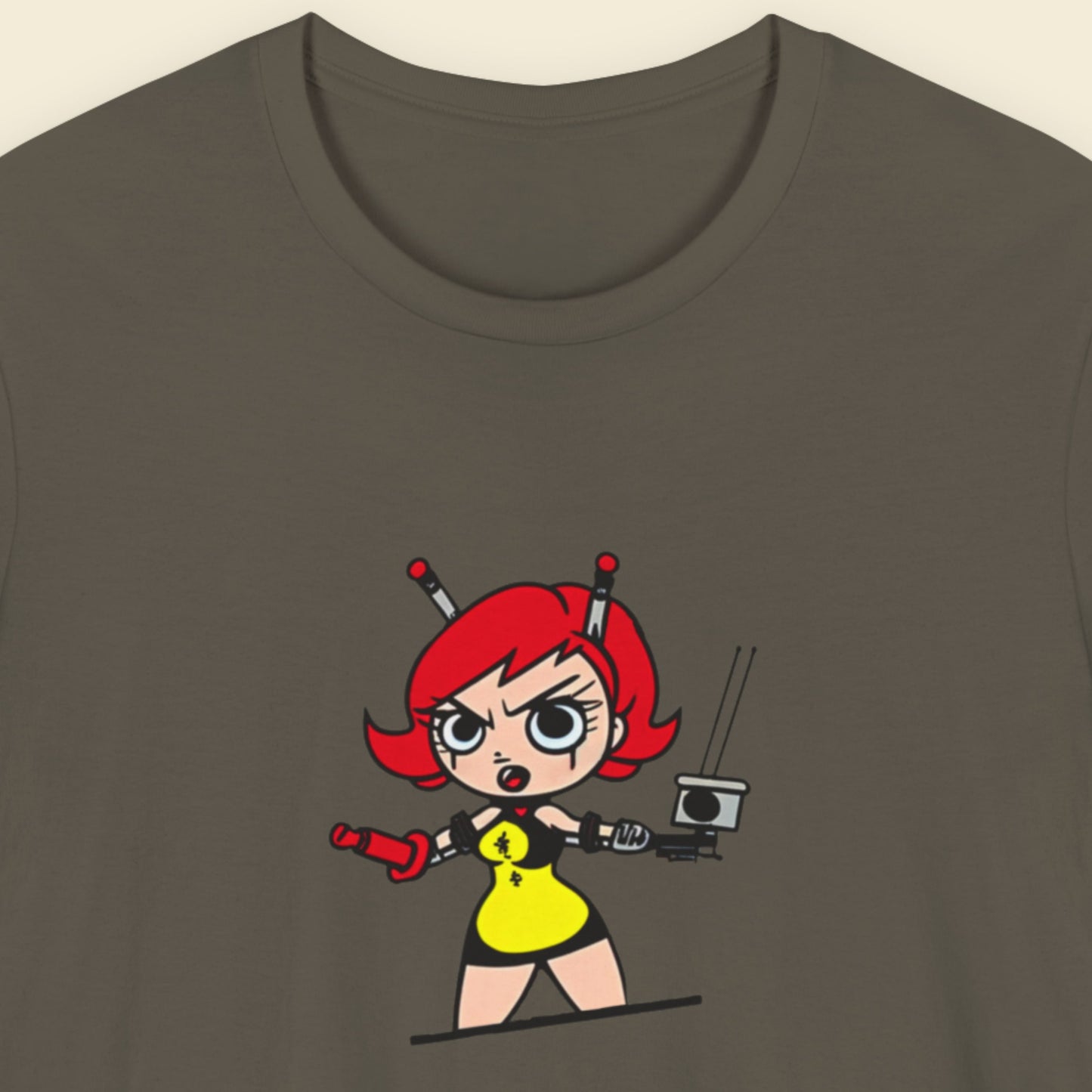 Army green t-shirt with a fun, colorful cartoon illustration on a beige background.