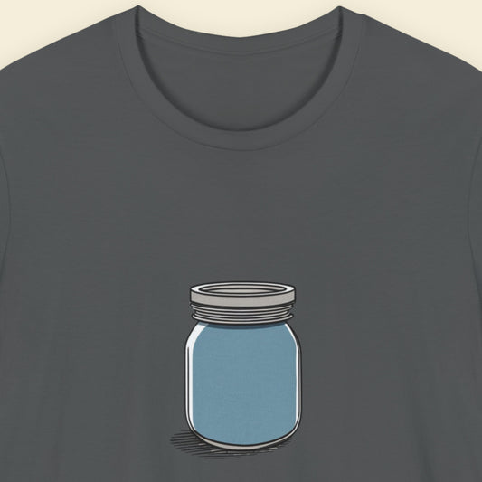 Grey shirt with a drawing of a blue jar against a beige background.