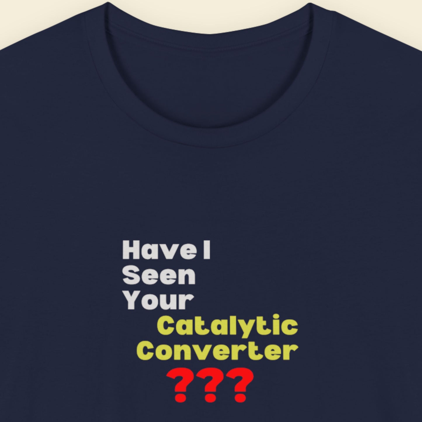 Navy blue t-shirt with humorous text design on a beige background.