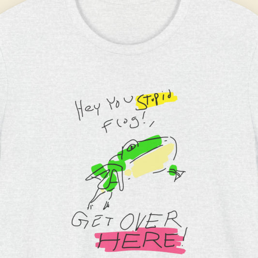 White t-shirt with a colorful graphic of a frog and text on a white background.