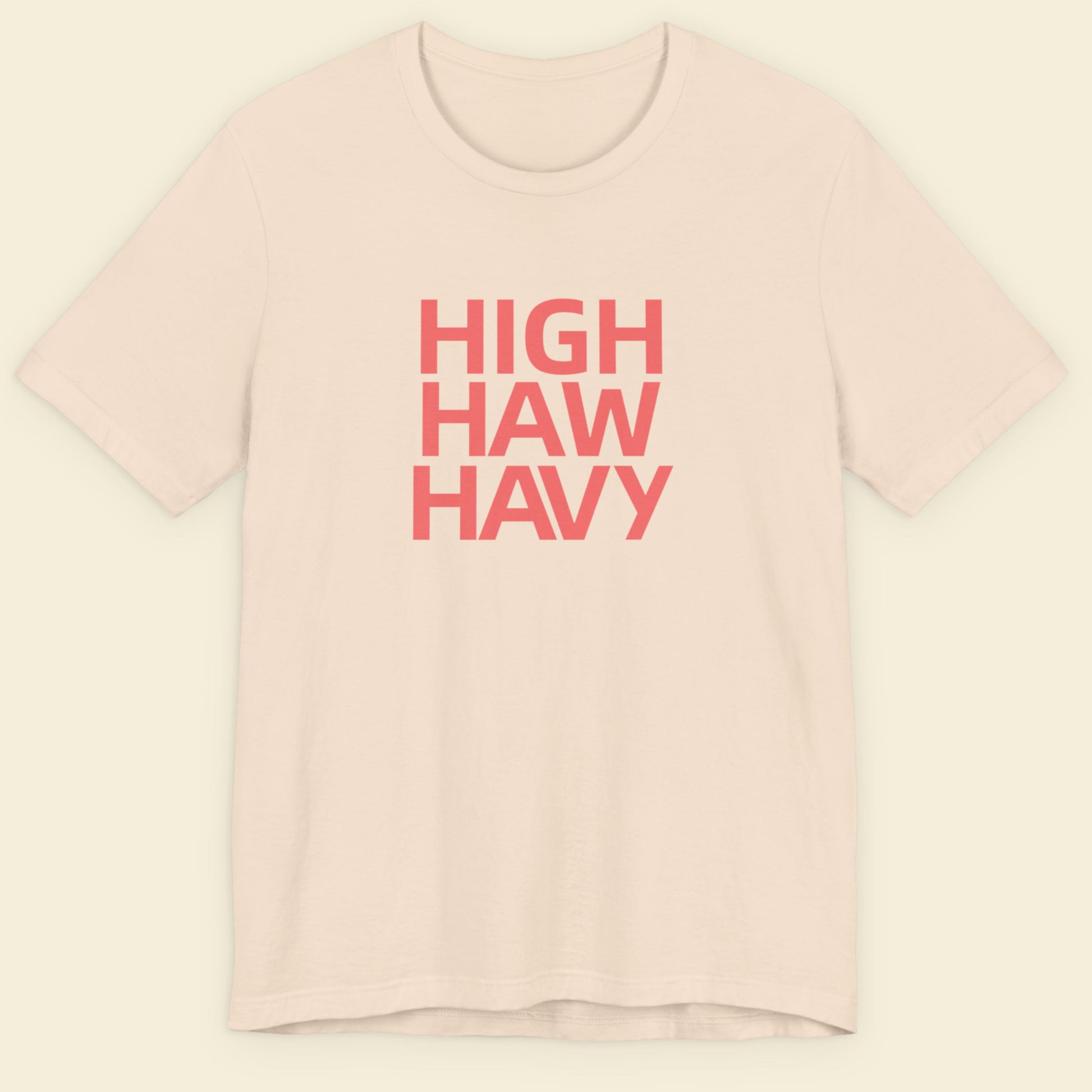 Beige t-shirt with multicolored nonsensical  'high haw havy' text on a beige background.