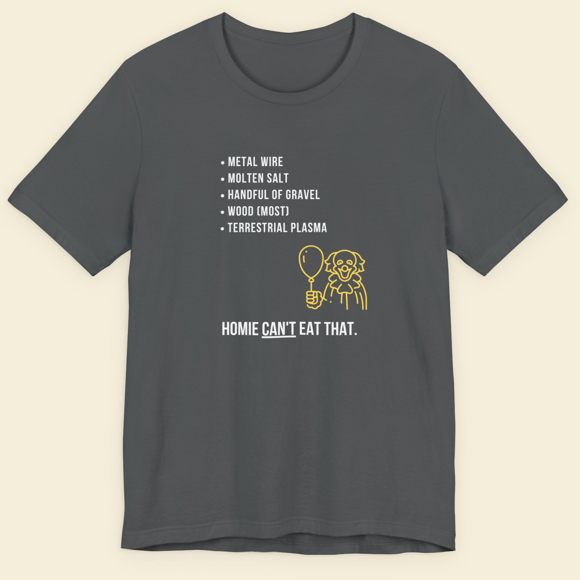 Dark gray t-shirt with humorous text and graphic on a beige background.
