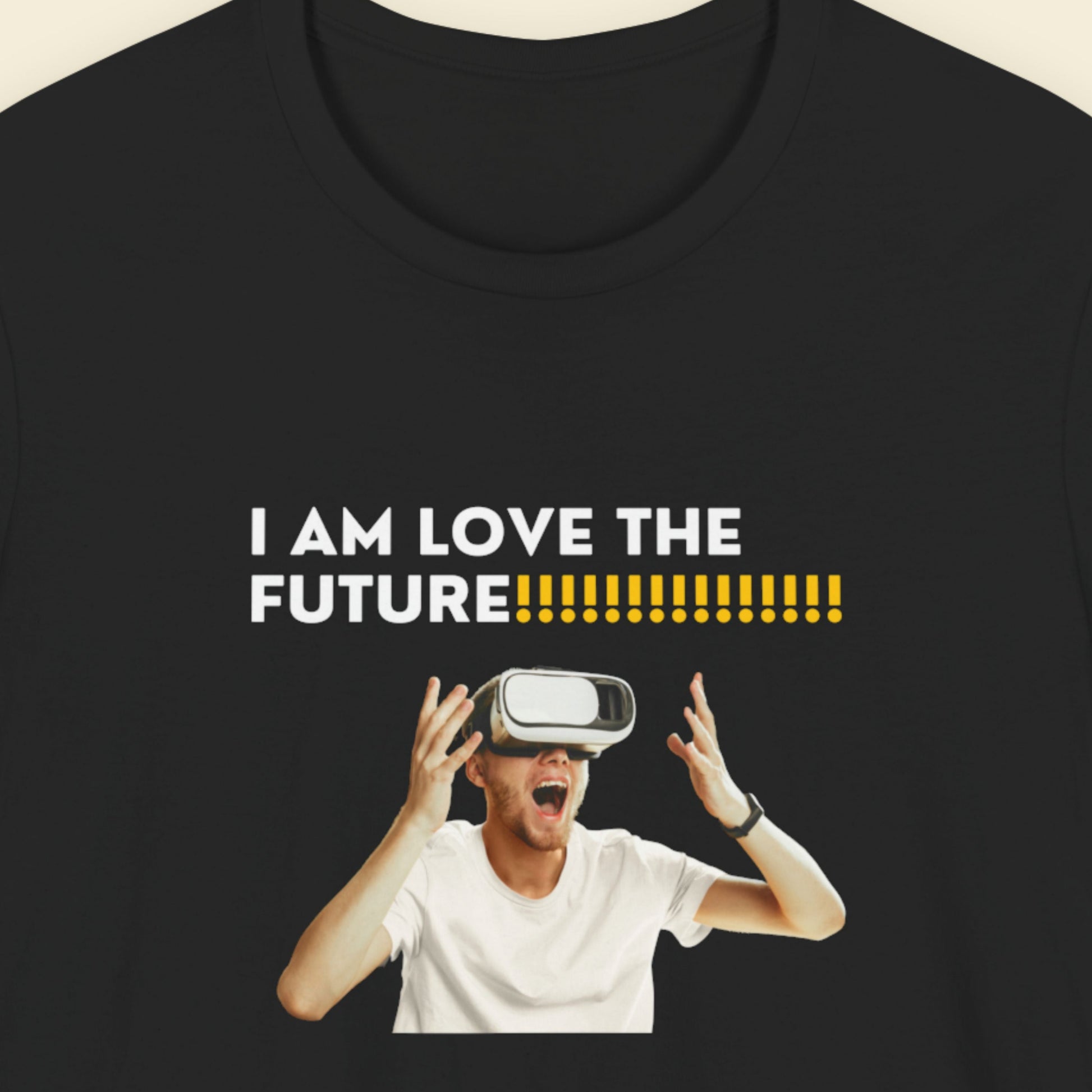 Black t-shirt with a graphic of a person wearing a VR headset and text 'I AM LOVE THE FUTURE' on a beige background.