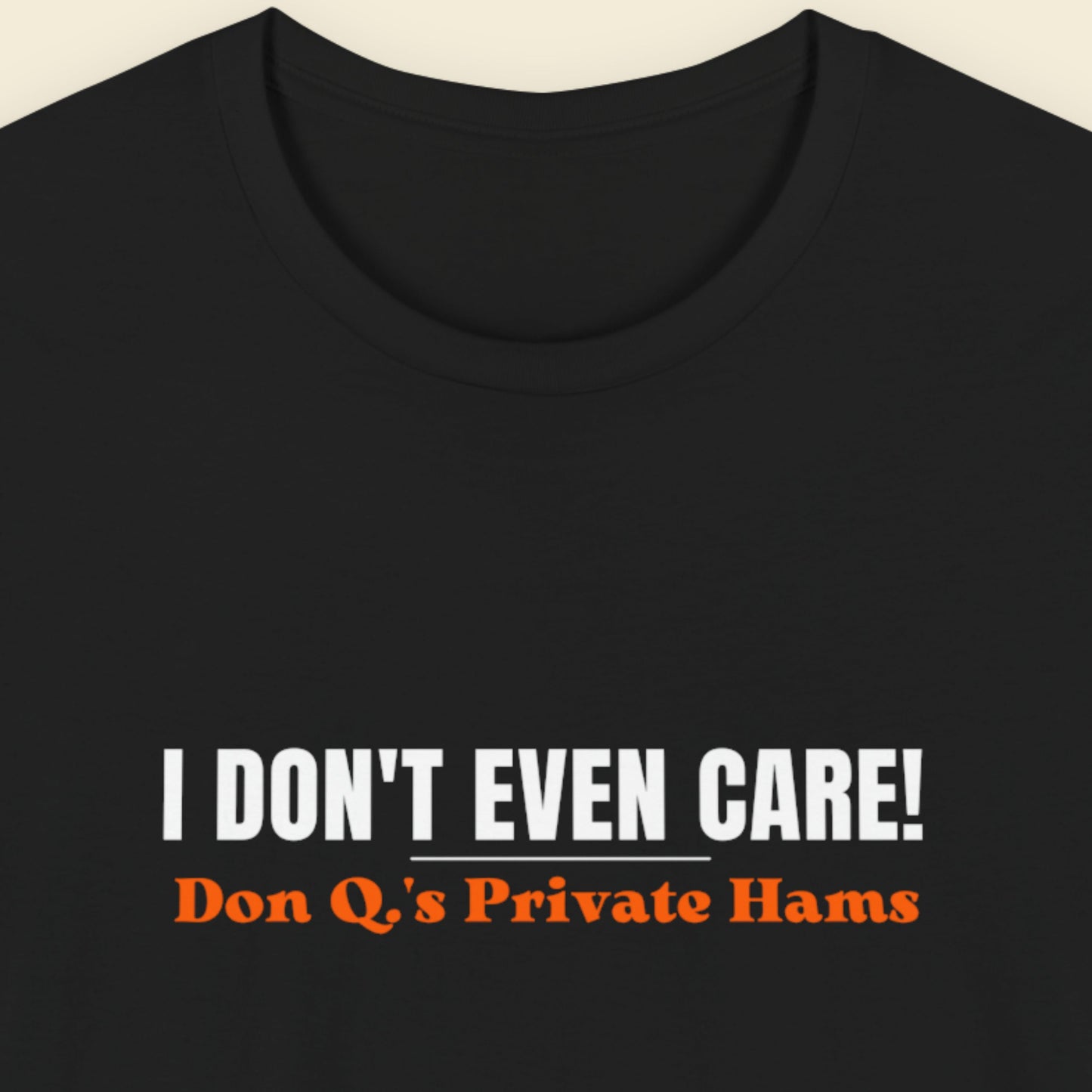 Black t-shirt with text 'I DON'T EVEN CARE! Don Q's Private Hams' on a beige background.