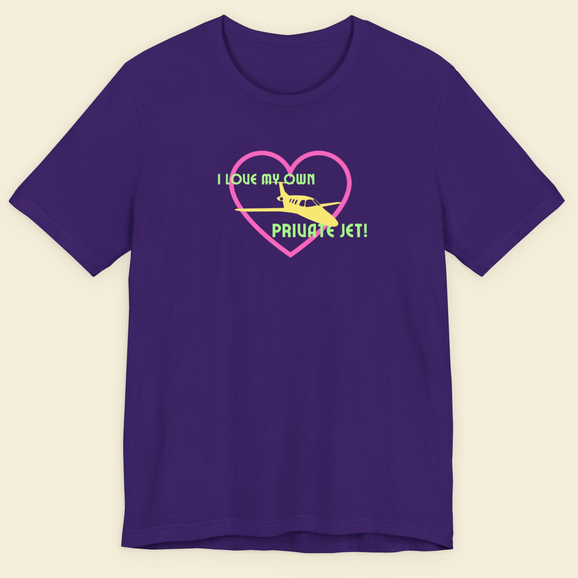 Purple t-shirt with a graphic design of a heart, airplane, and text on a beige background.