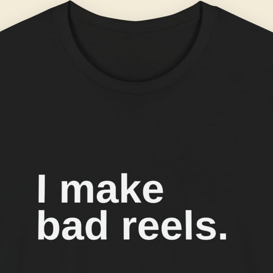Black t-shirt with white text 'I make bad reels' on a beige background.