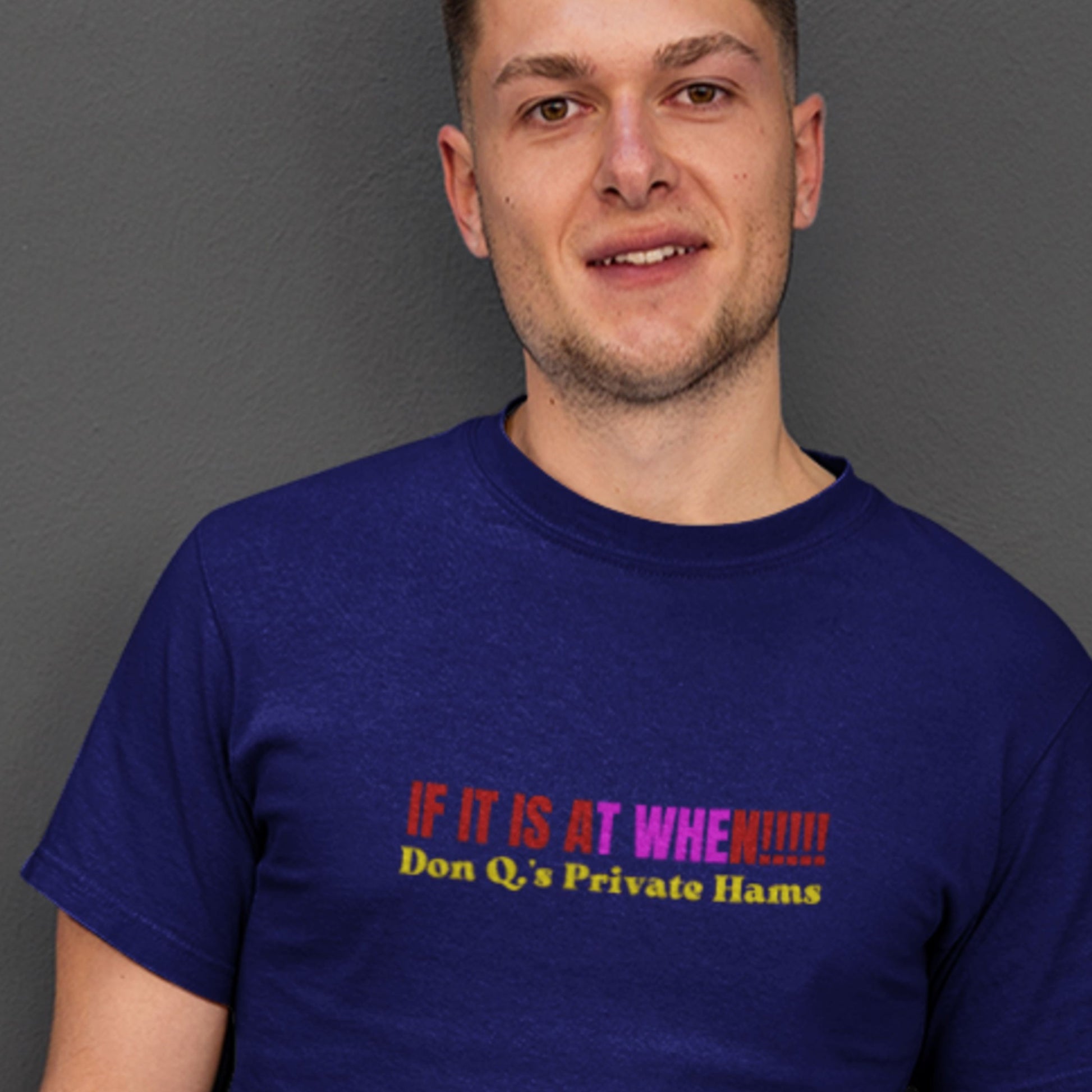 Man wearing a navy shirt with nonsensical saying in colorful text.