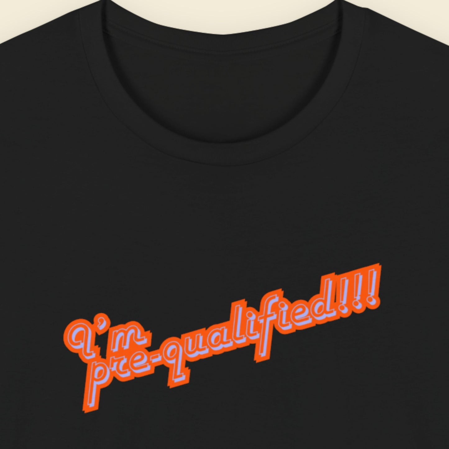 Black t-shirt with multicolored text reading 'I'm pre-qualified!!!' on a beige background.