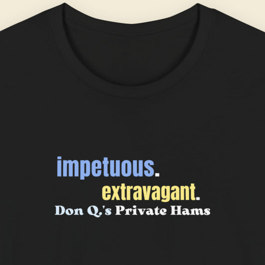 Black t-shirt with multicolored 'impetuous. extravagant.' text on a beige background.