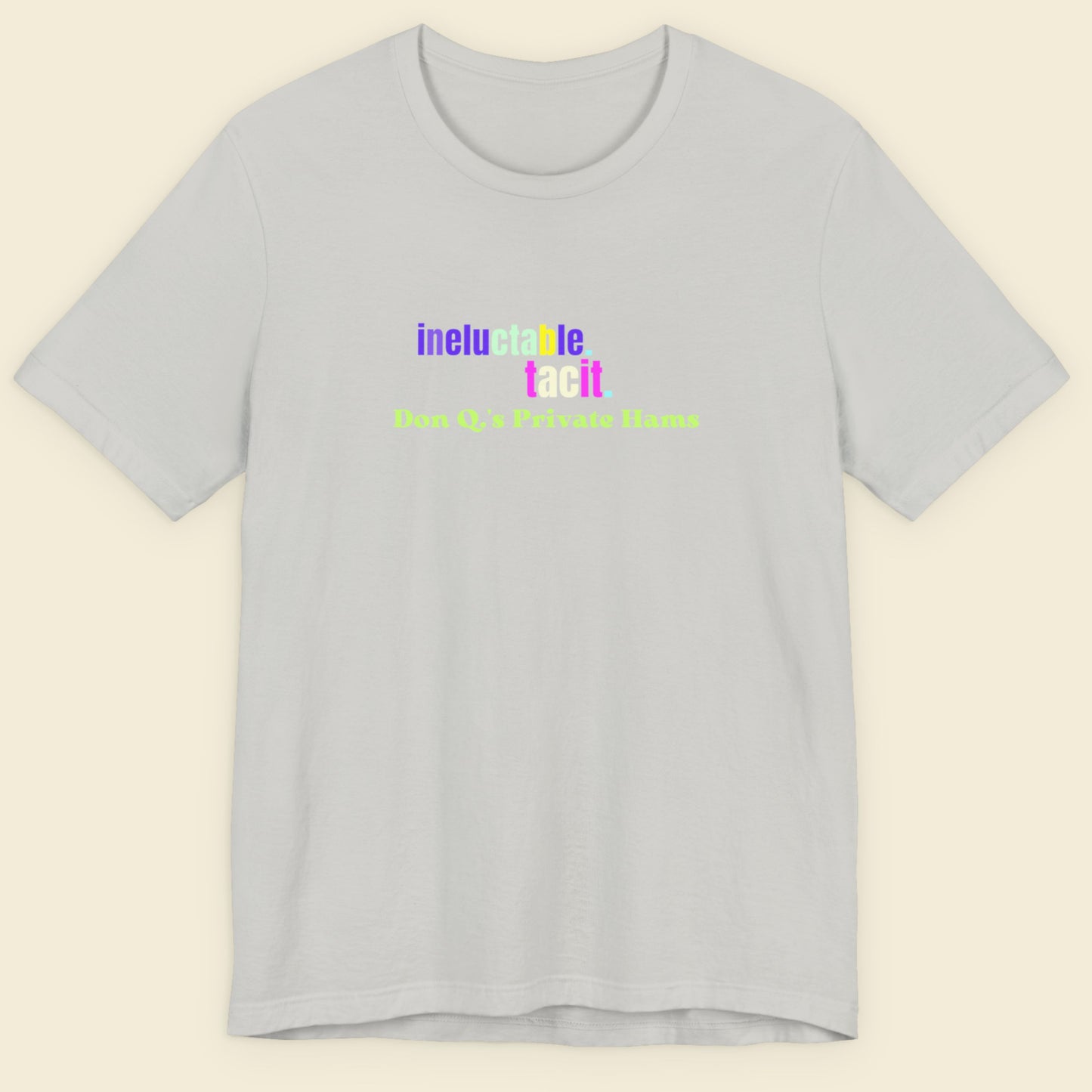 Gray t-shirt with colorful text on a beige background.