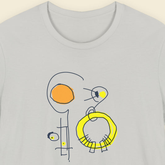Grey t-shirt with a colorful abstract drawing on a beige background.