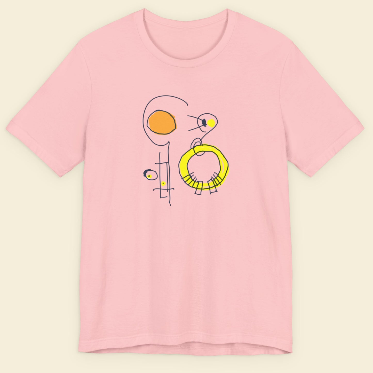 Pink t-shirt with a colorful abstract drawing on a beige background.