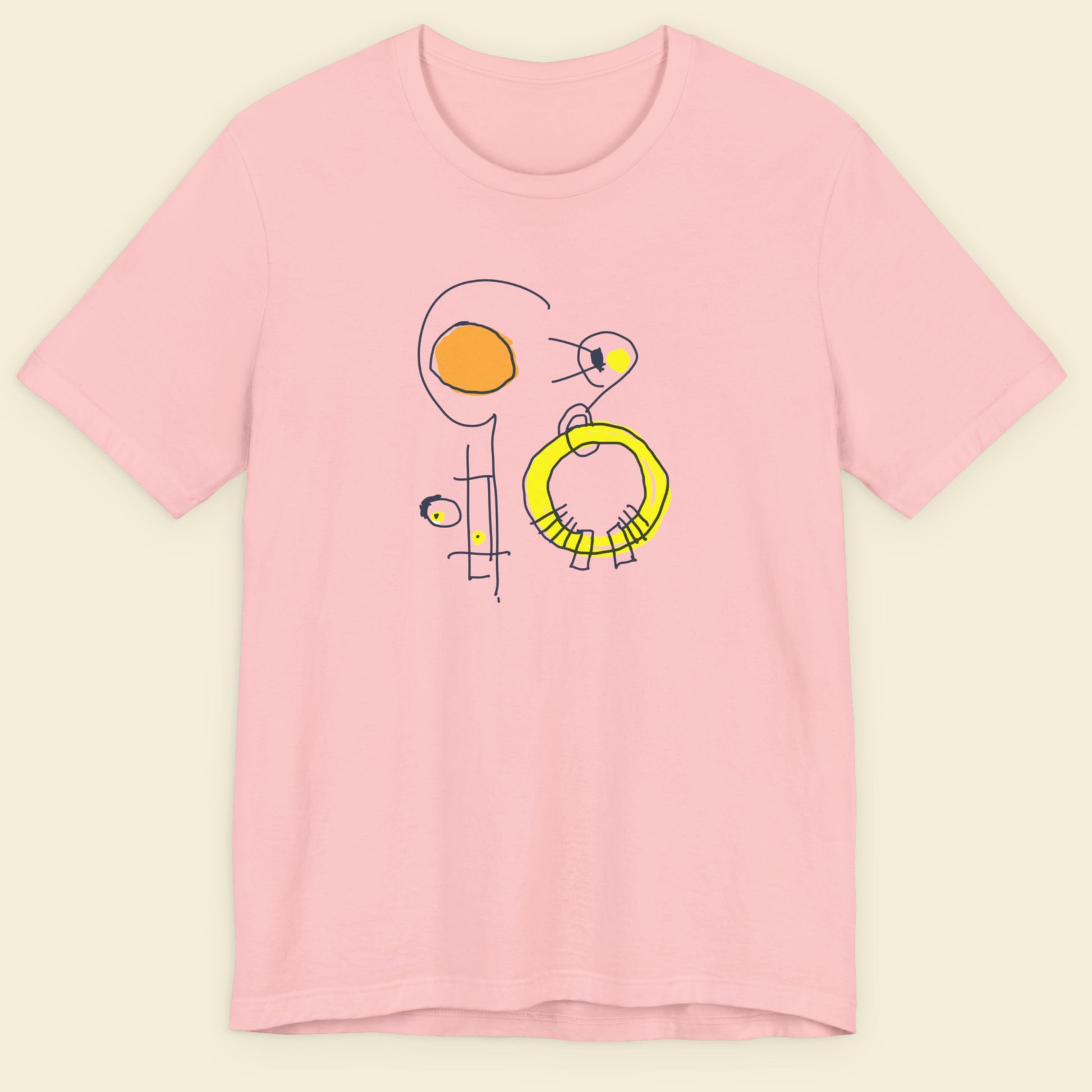 Pink t-shirt with a colorful abstract drawing on a beige background.