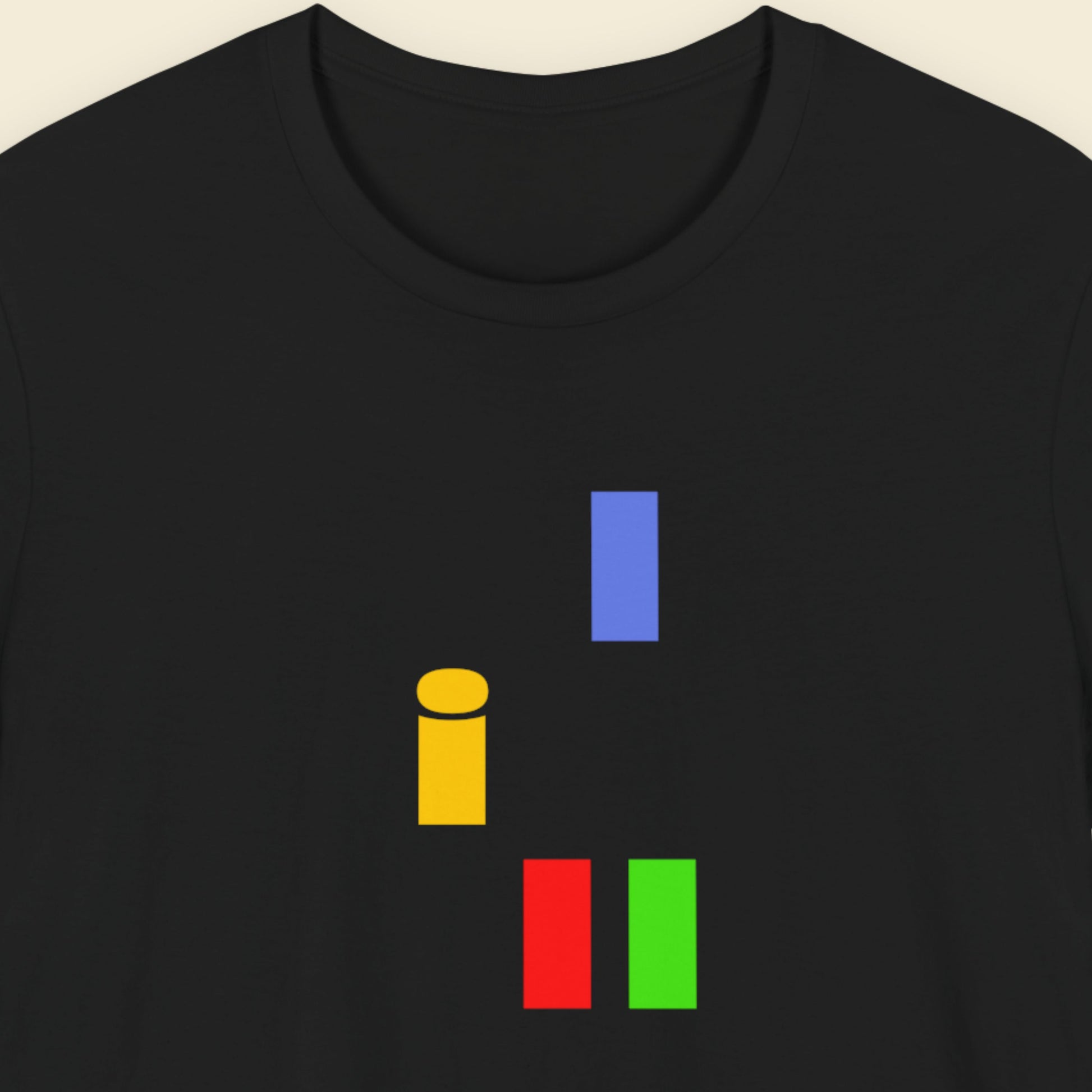 Black t-shirt with colorful abstract shapes  on a beige background.