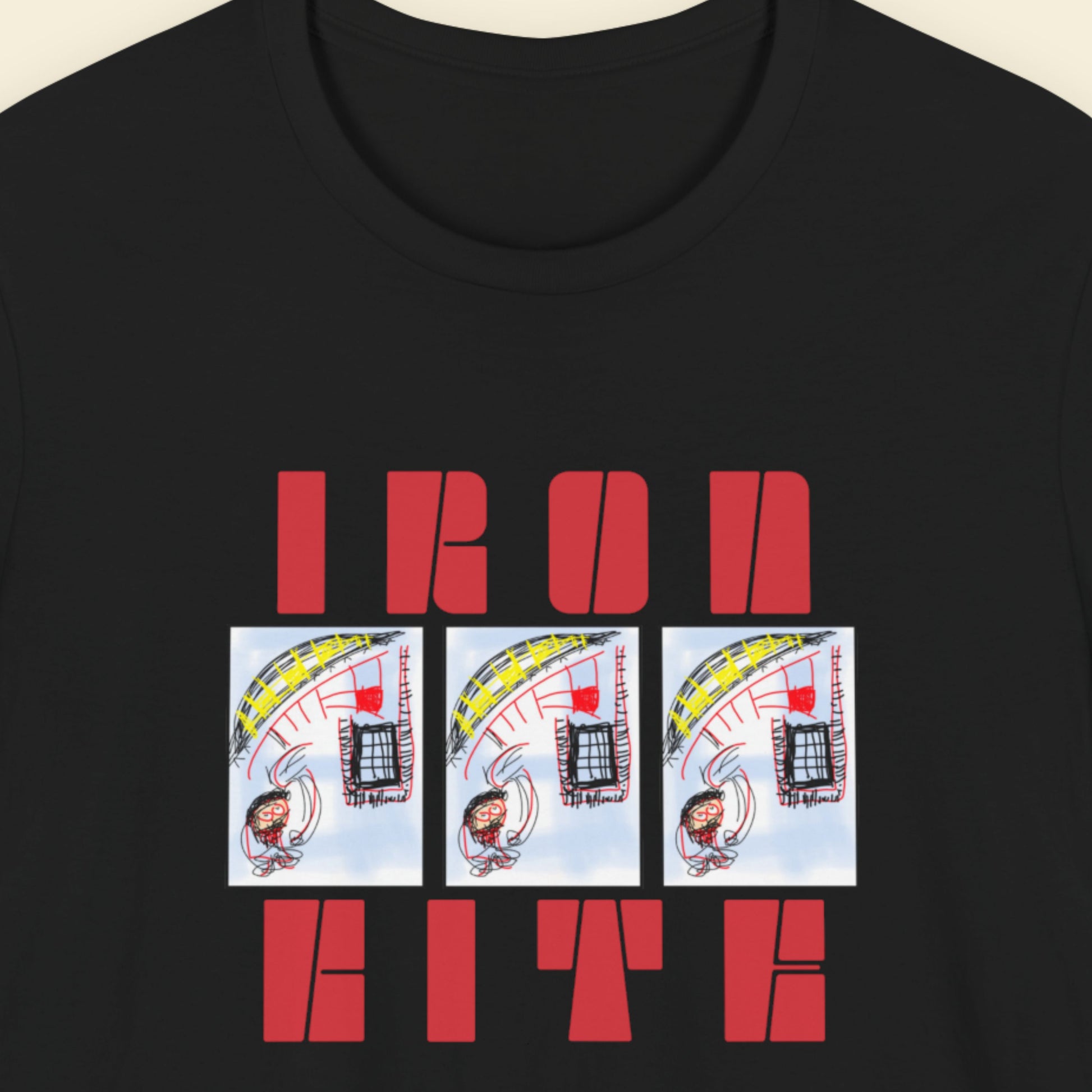 Black t-shirt with red text and cartoon designs on a beige background.
