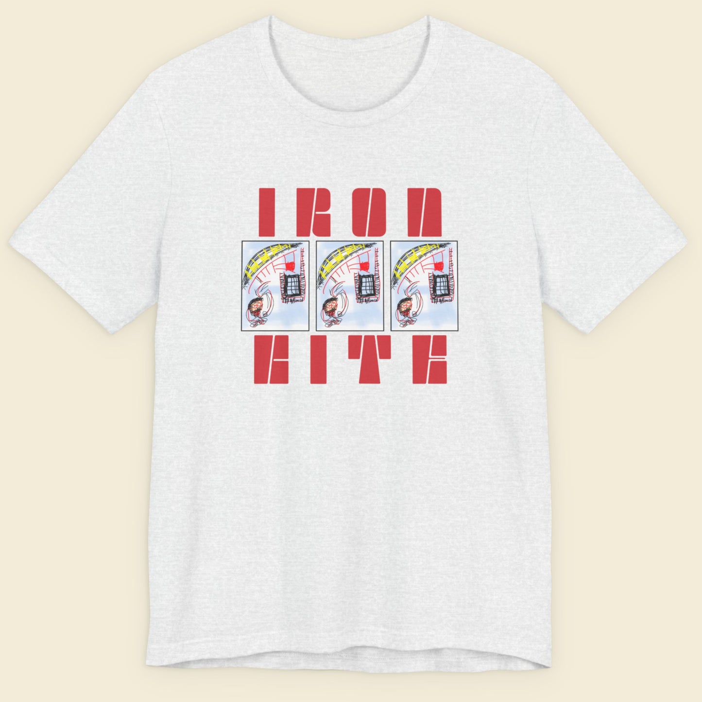 Ash grey t-shirt with red text and graphic design on a beige background.
