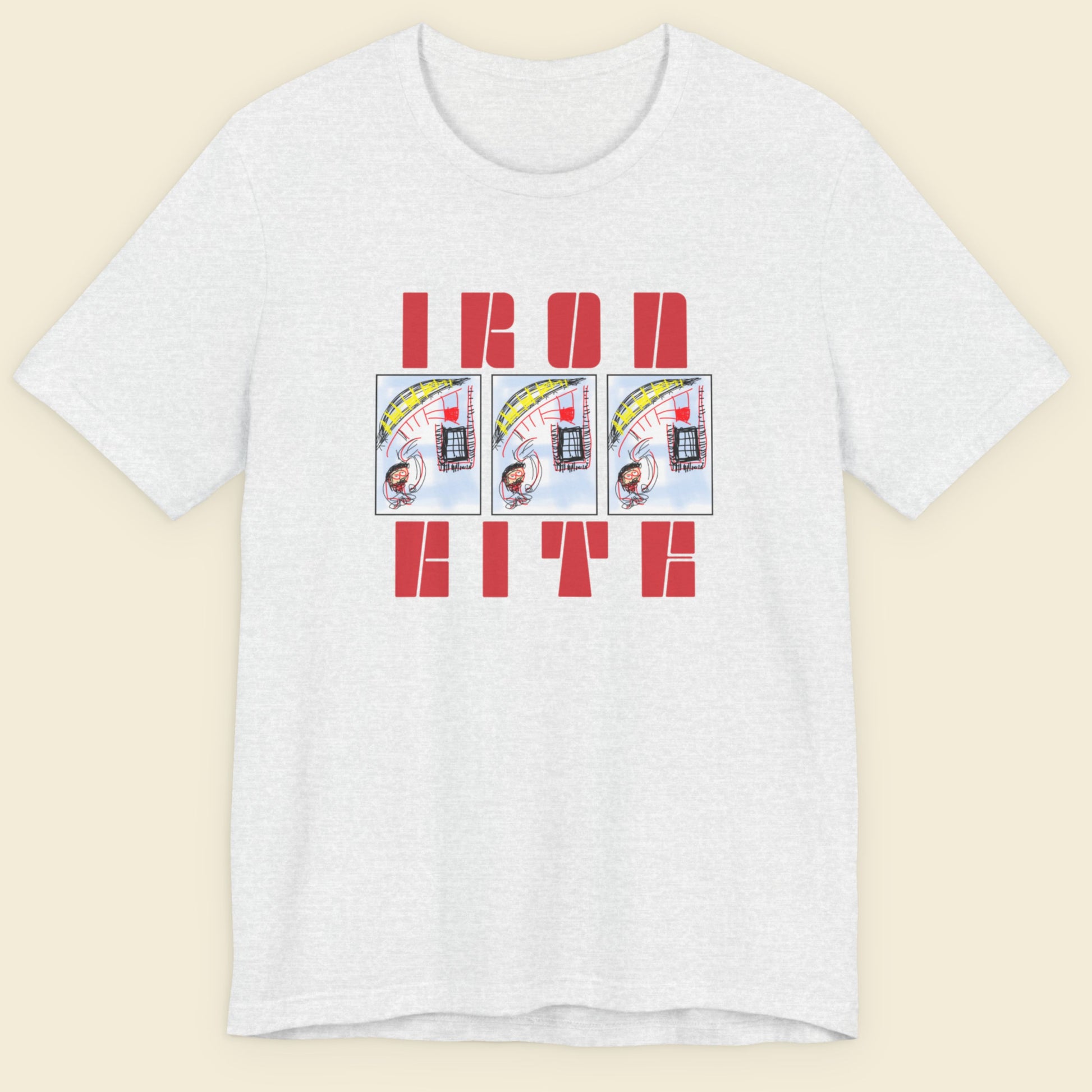 Ash grey t-shirt with red text and graphic design on a beige background.
