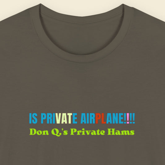 army green shirt with multi-colored text on beige background
