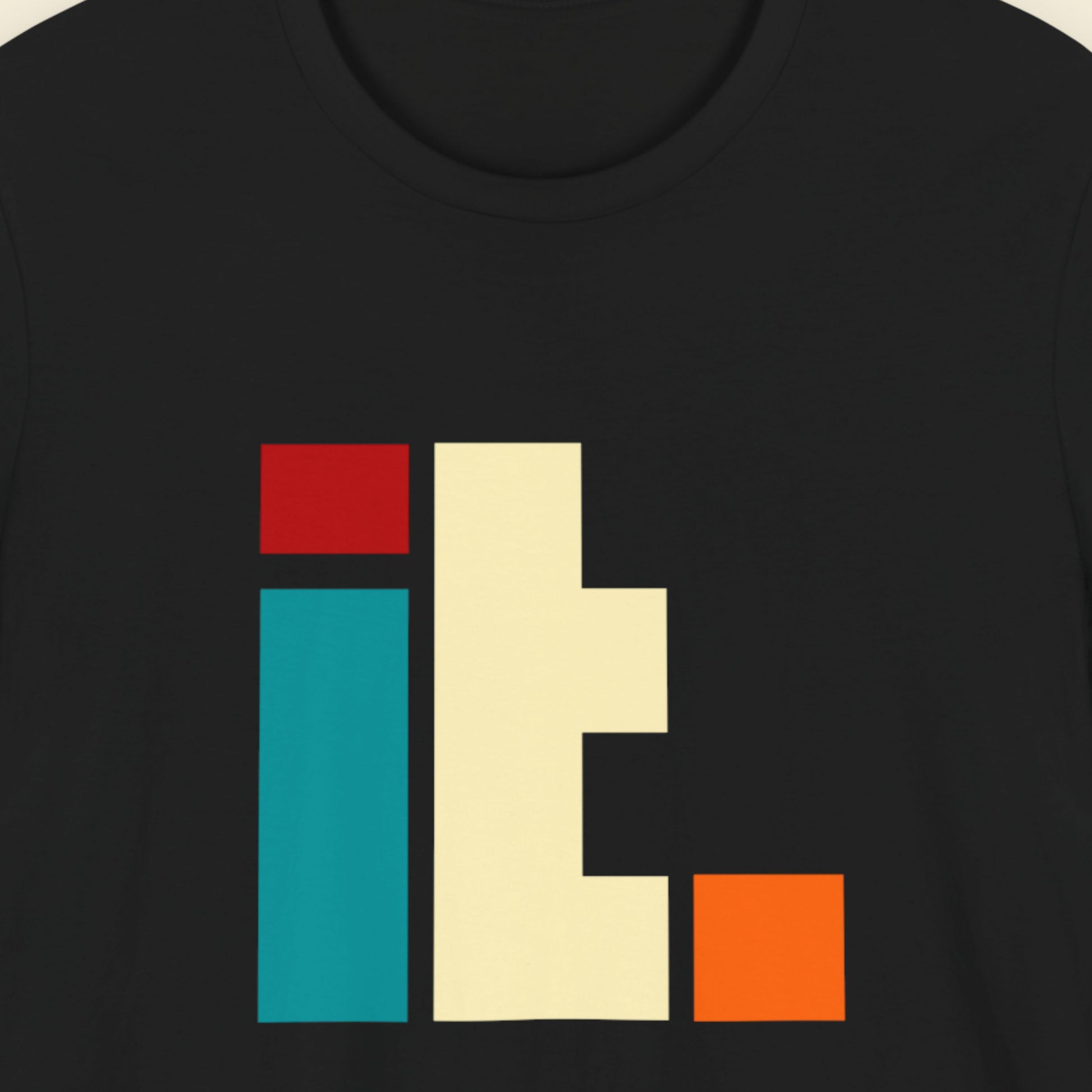 Black t-shirt with colorful geometric design on a plain background.