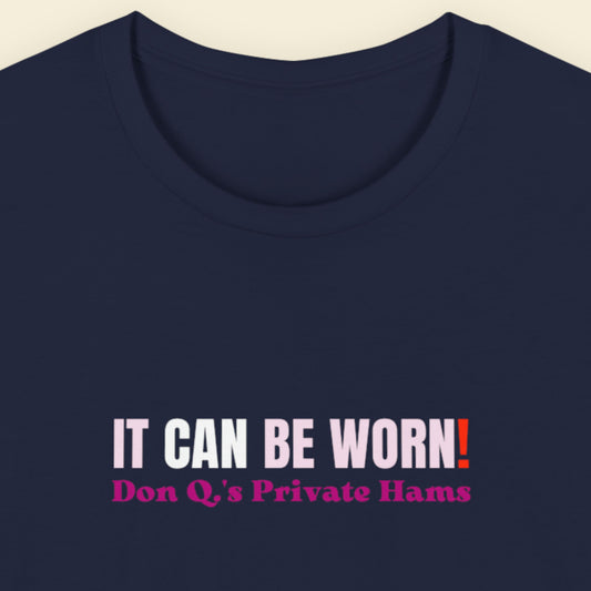 Navy blue t-shirt with humorous text design on a beige background.