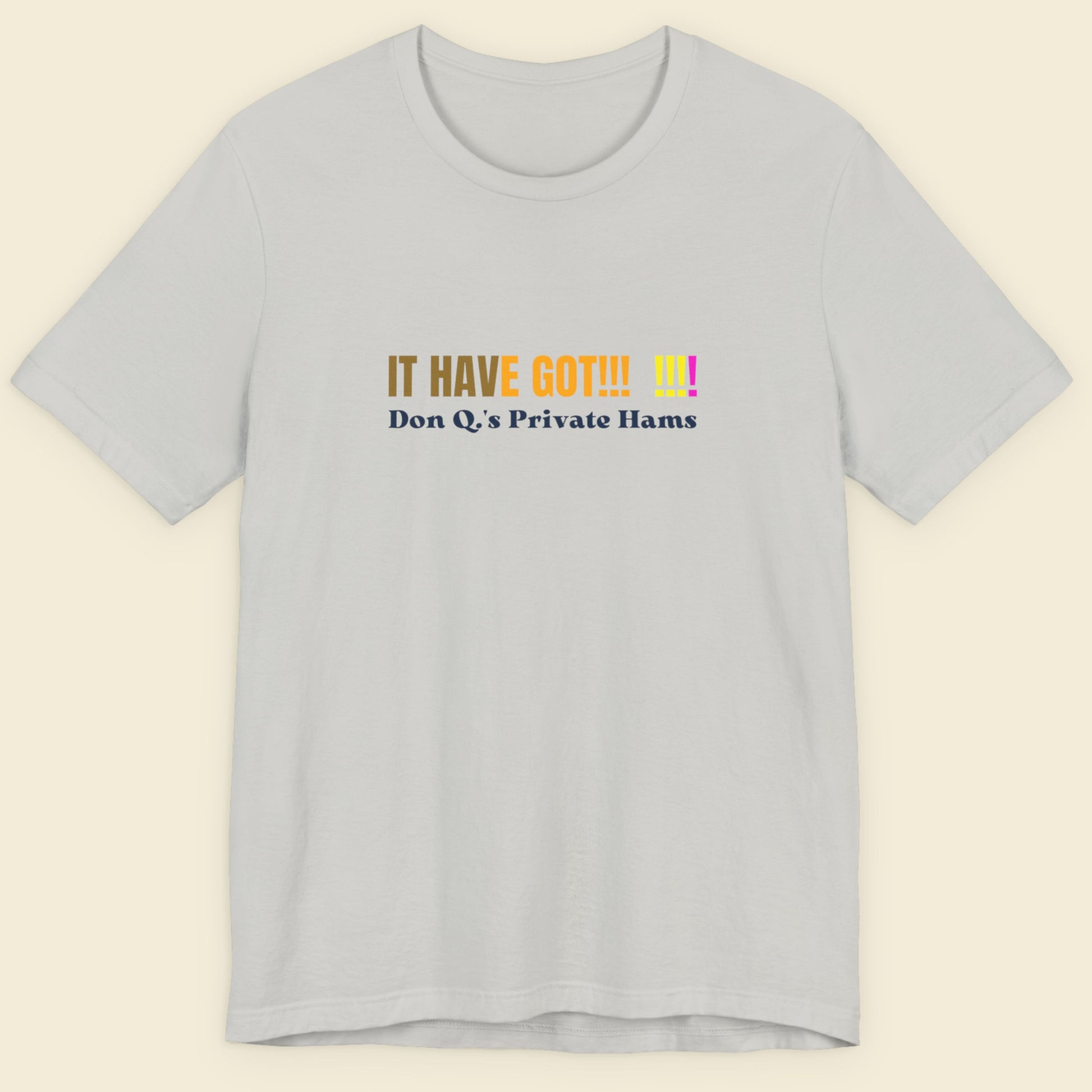 Light grey shirt with colorful nonsensical text on a beige background.