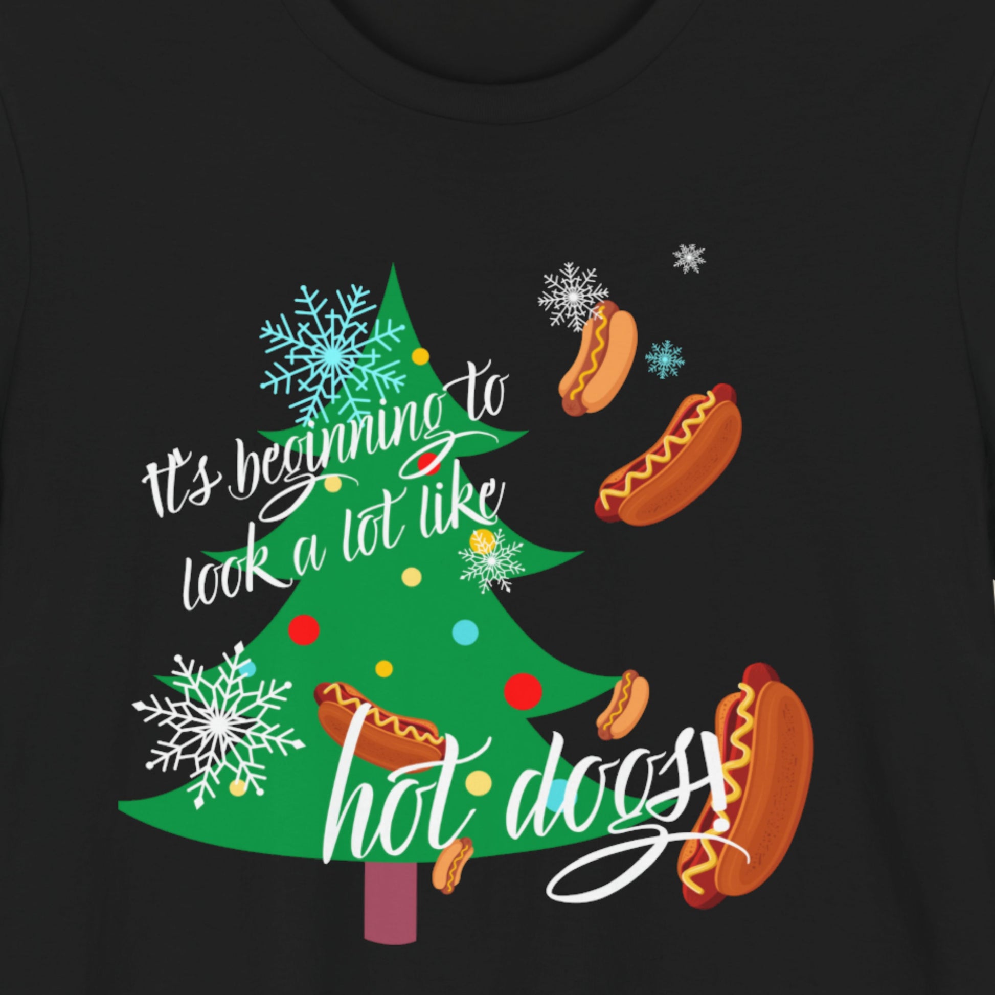 Black t-shirt with a fun, colorful holiday illustration on a beige background.