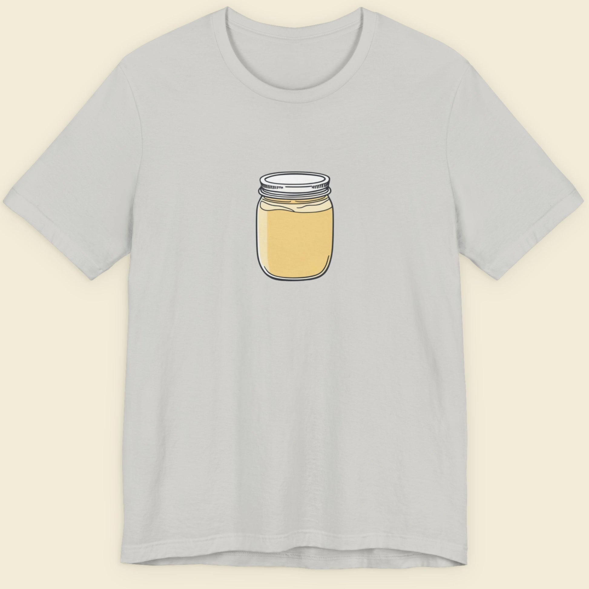 Light grey shirt with a drawing of a jar of custard.